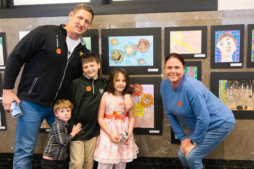 Students and their family at an art show